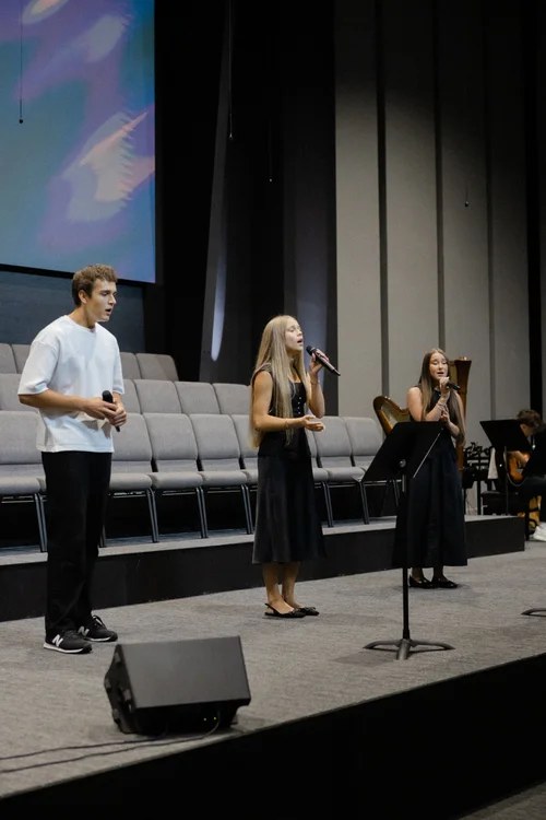 Young people participating in worship