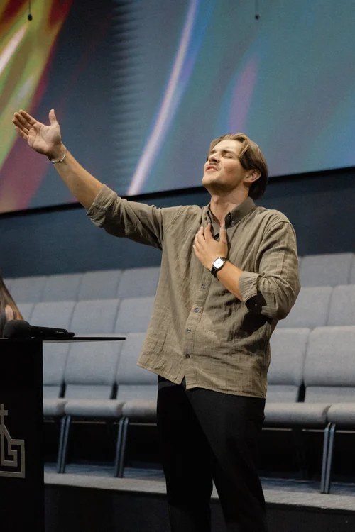 Andrew Voznyuk serving in worship